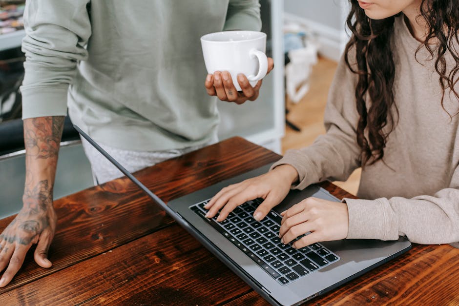 A girl doing web design on laptop